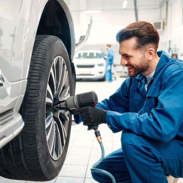 A mechanic changing a tire